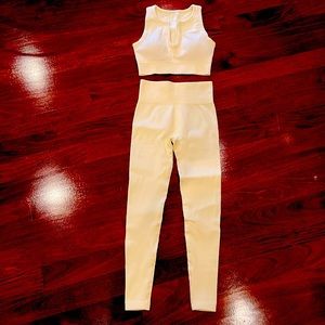 Cream ribbed athleisure cropped top and leggings set.